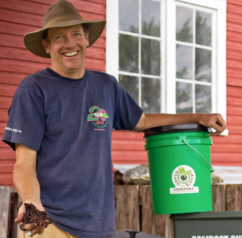 Farmer John Hayden shows some of the red wiggler worms that process food scraps.